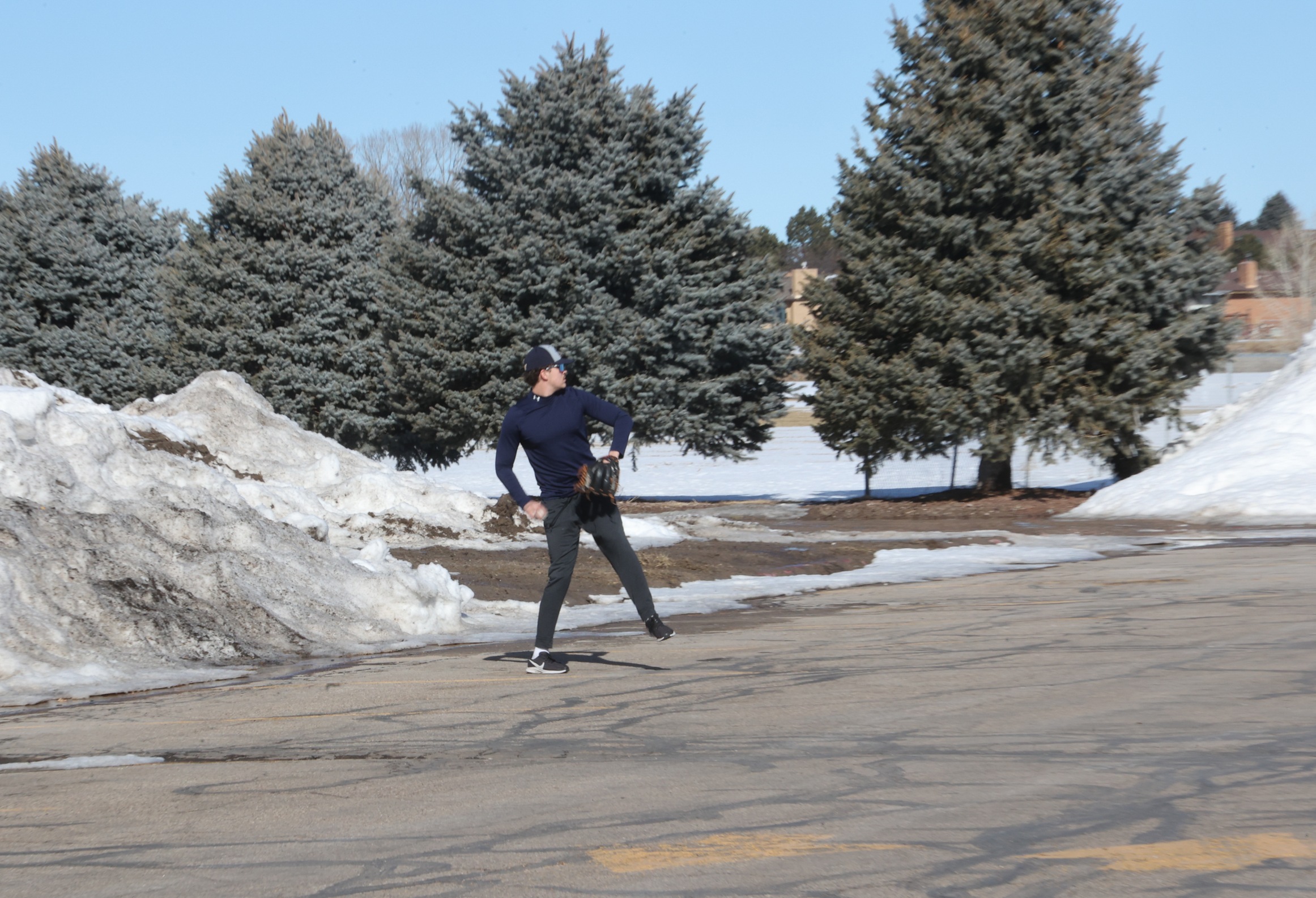 Cougar players play catch out in the parking lot. Photo by Jenna Curtis.
