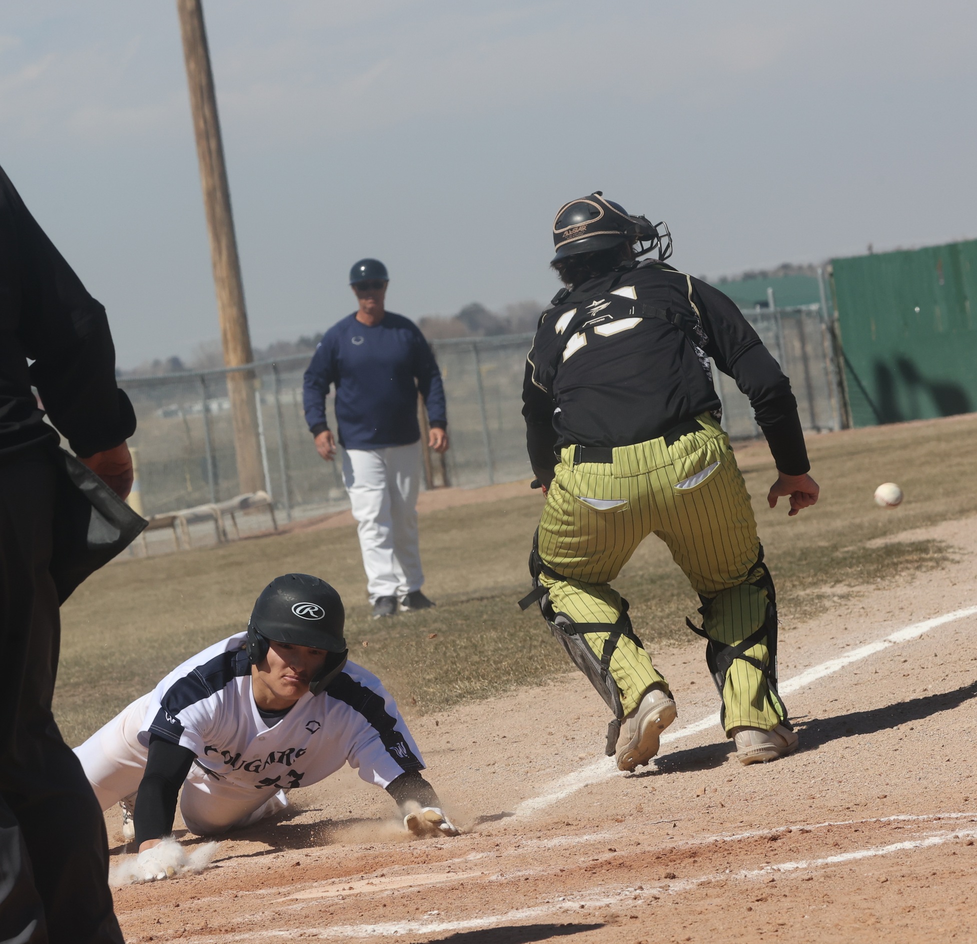 Hunter McCollum sliding into home against NJC.