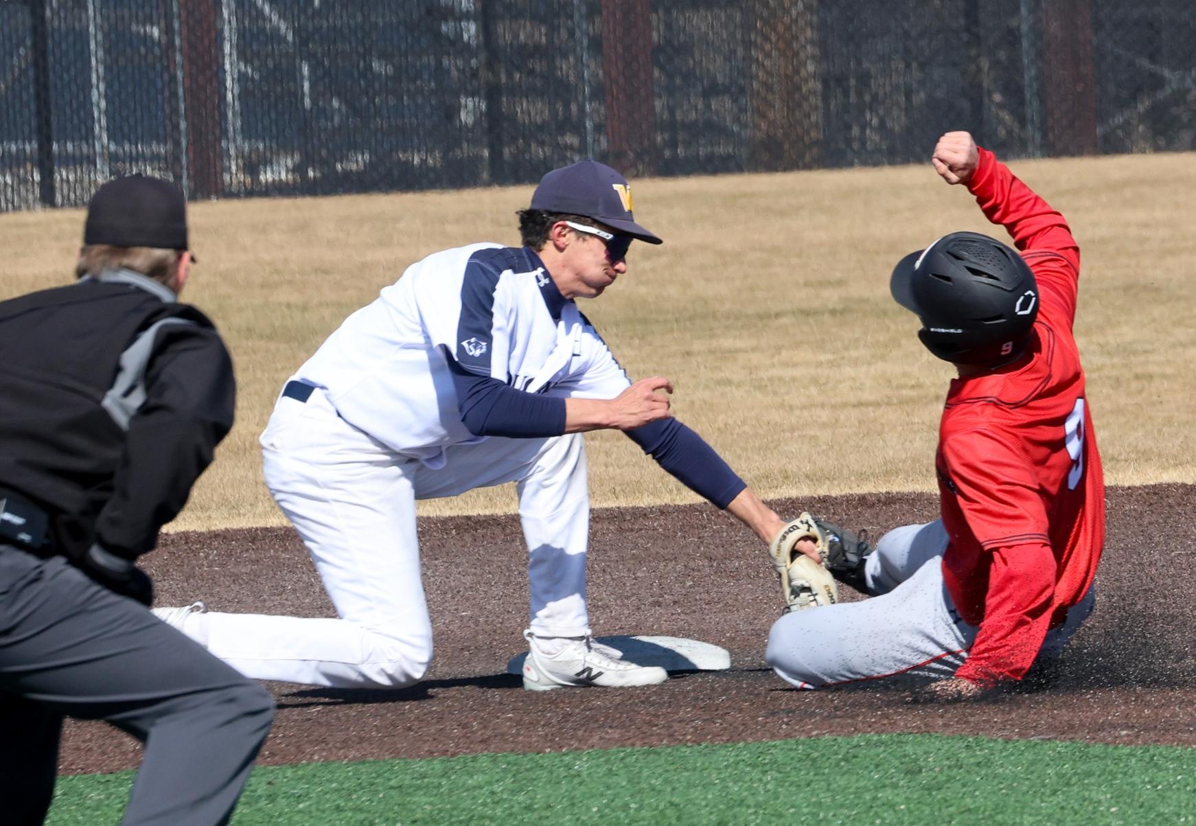 Calab Ciciari tags out a runner at second base in the first game of a doubleheader with Northeast on Wednesday at Cleveland Field.