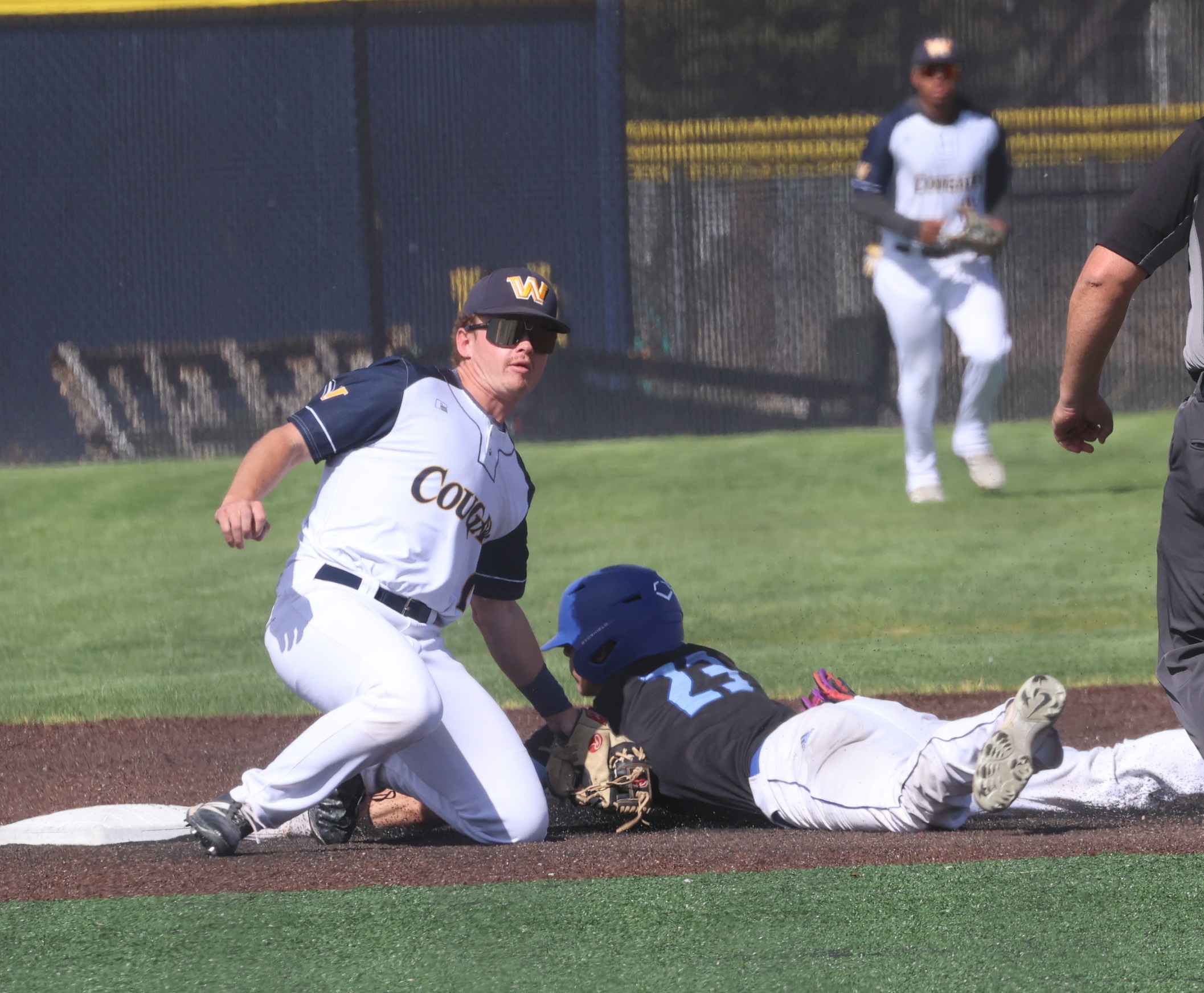 Jude Russell puts a tag on a McCook runner in game two of their game on Wednesday. WNCC lost the first 12-3 and won the second 19-9.
