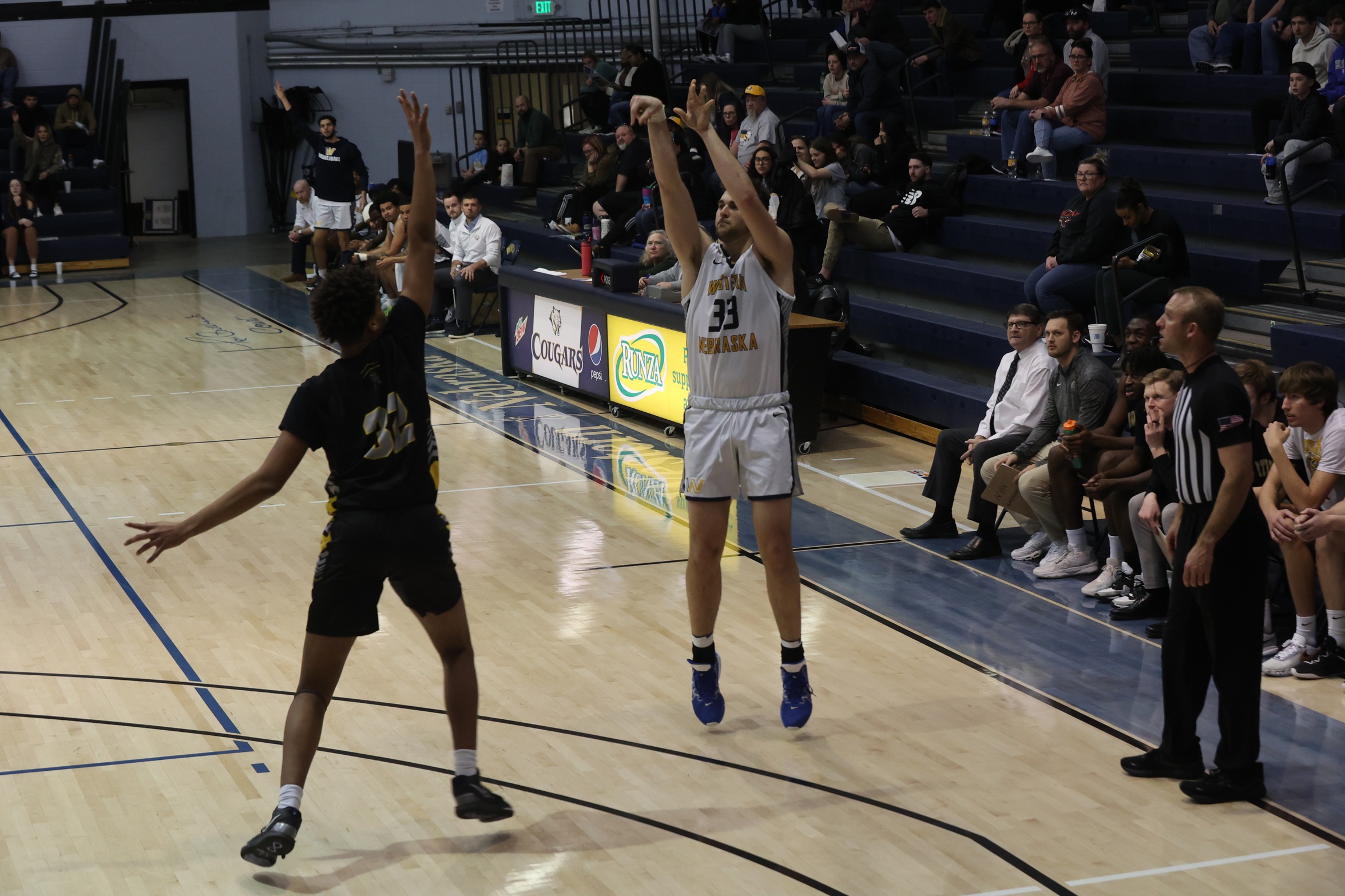 Zach O'Callaghan takes a 3-point shot.
