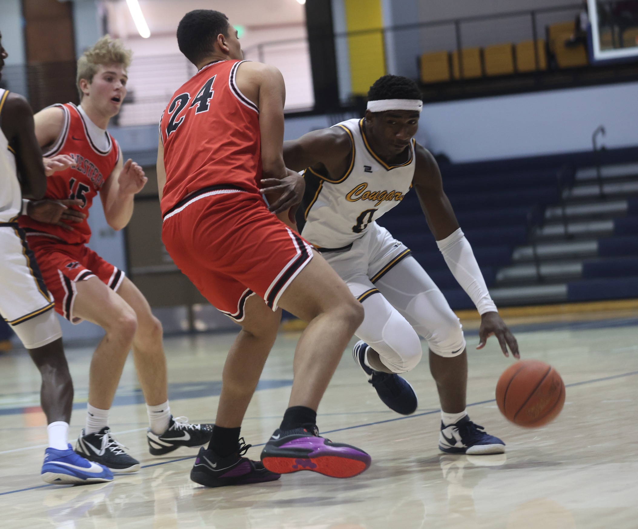 JJ Harris drives to the basket against Western Wyoming.