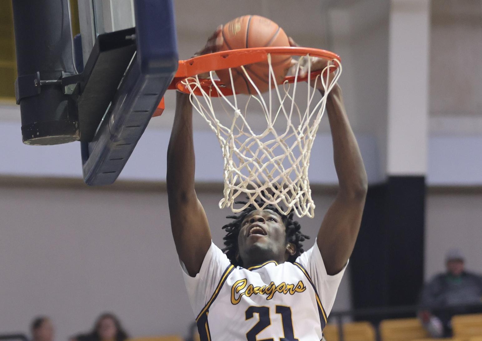 Kendrick Preston slams home two points in the second half.