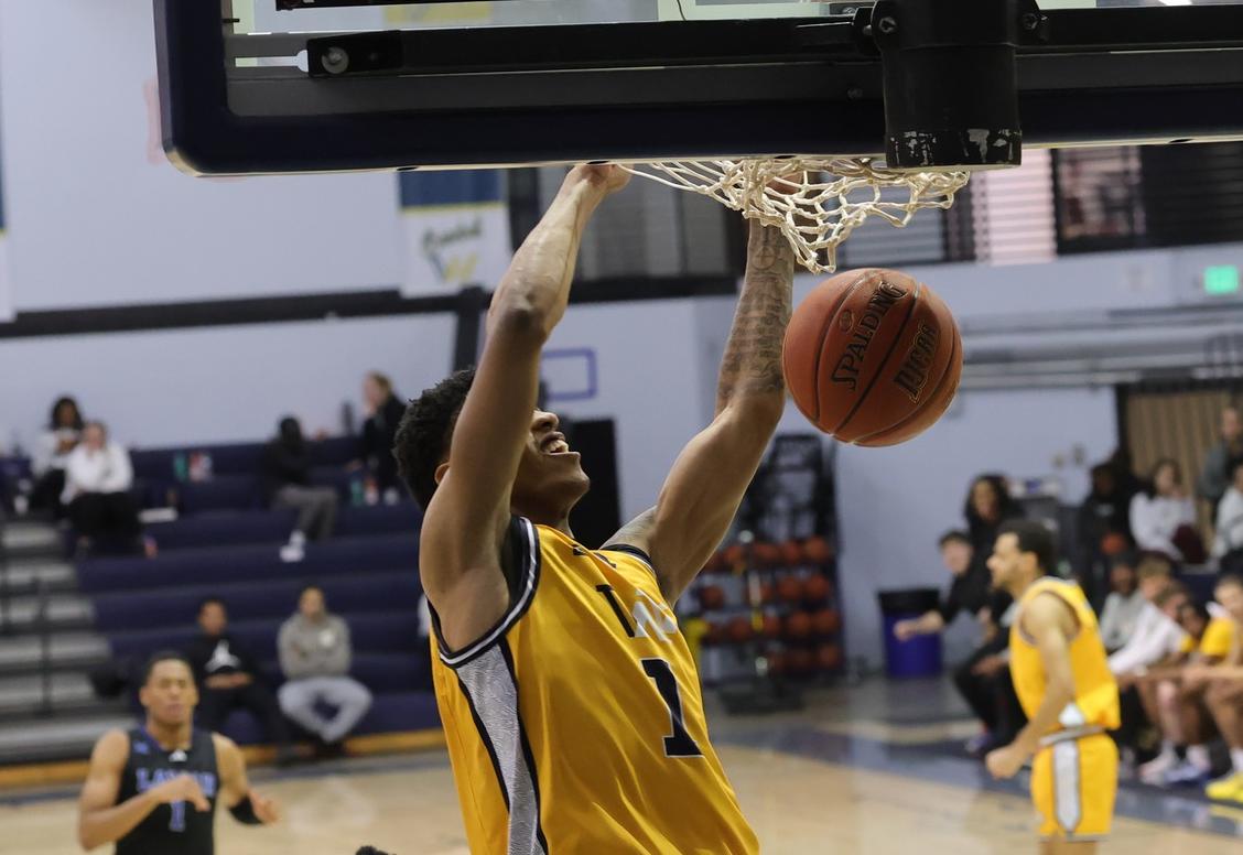 Noah Jones slams home a dunk against Lamar.