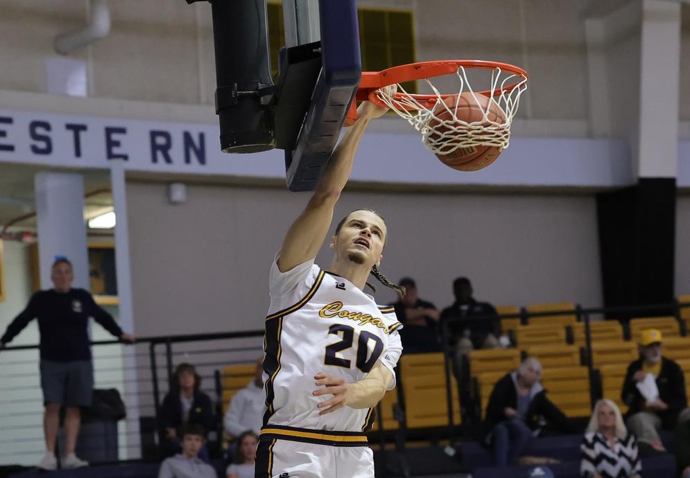Toms Linis goes up for a dunk in the second half against Miles.