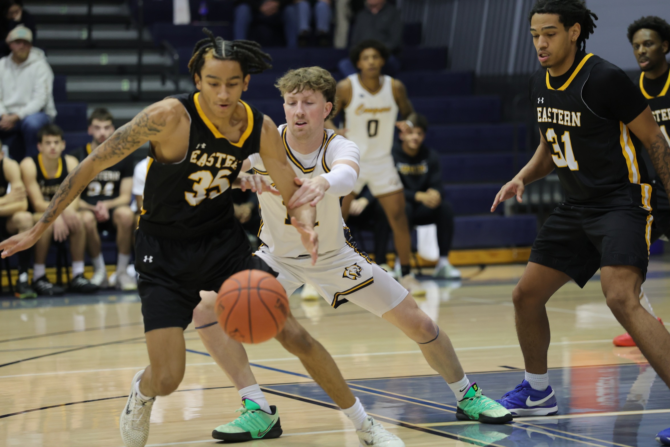 WNCCs's Max Orchard goes after a loose ball in their game with EWC on Tuesday.