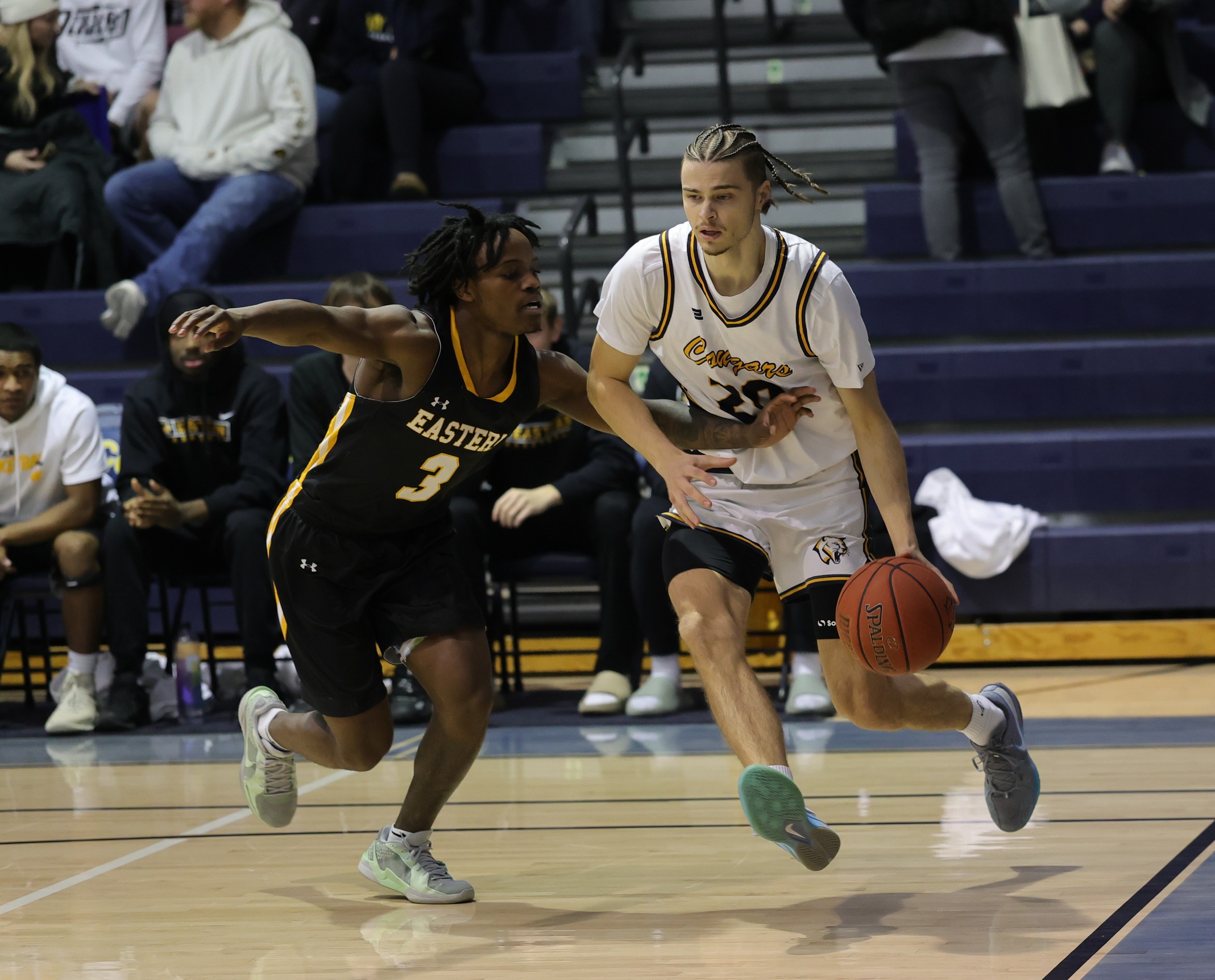 Toms Linis drives the baseline in a home game against EWC earlier this season.