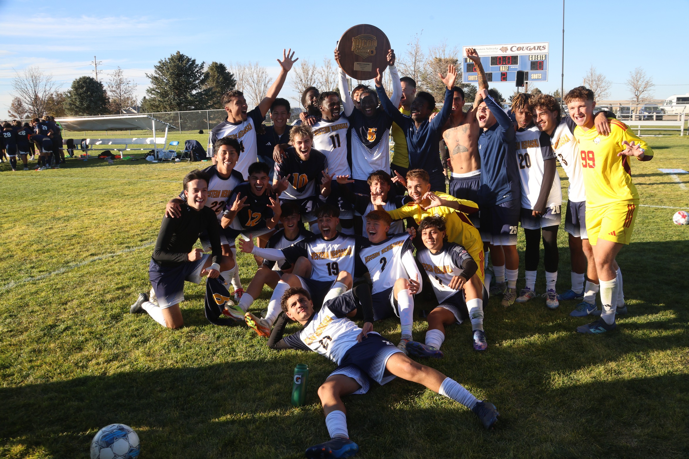 The WNCC men's soccer team hold up the Region IX trophy after topping Otero 2-0 on Saturday.