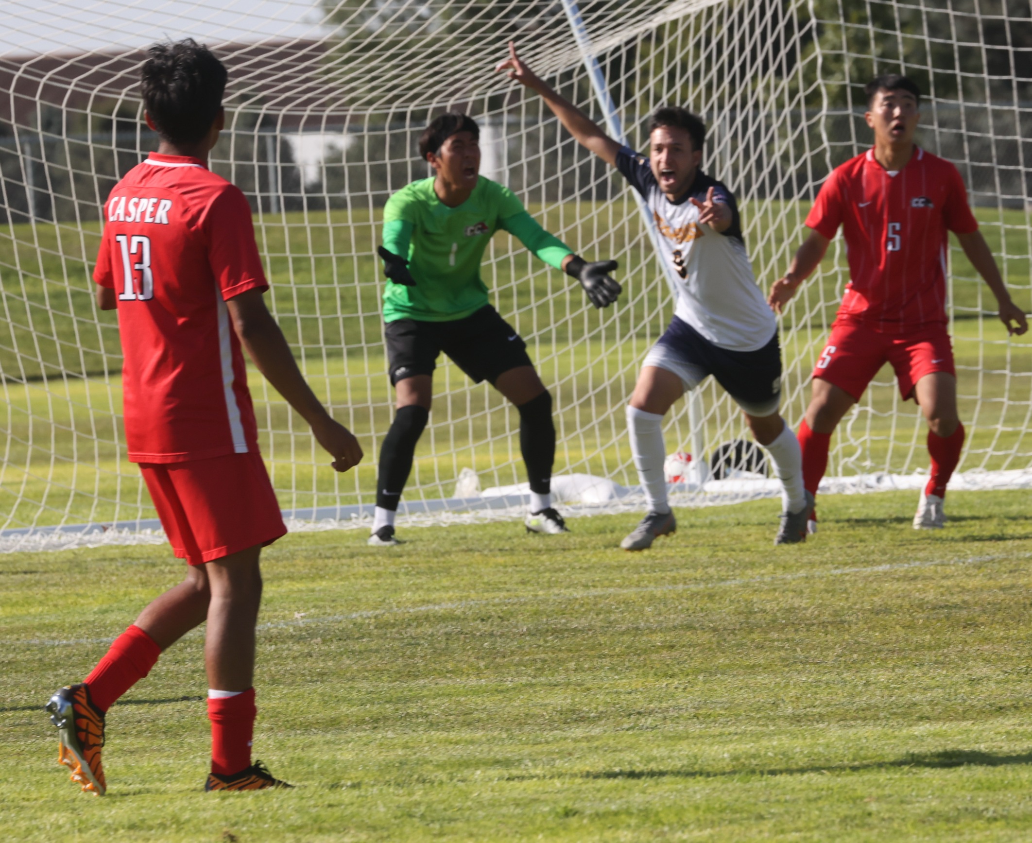 WNCC celebrating a goal.