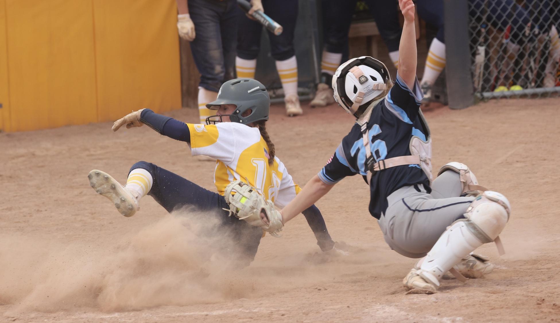 Victoria Wharton slides into home plate against Otero.
