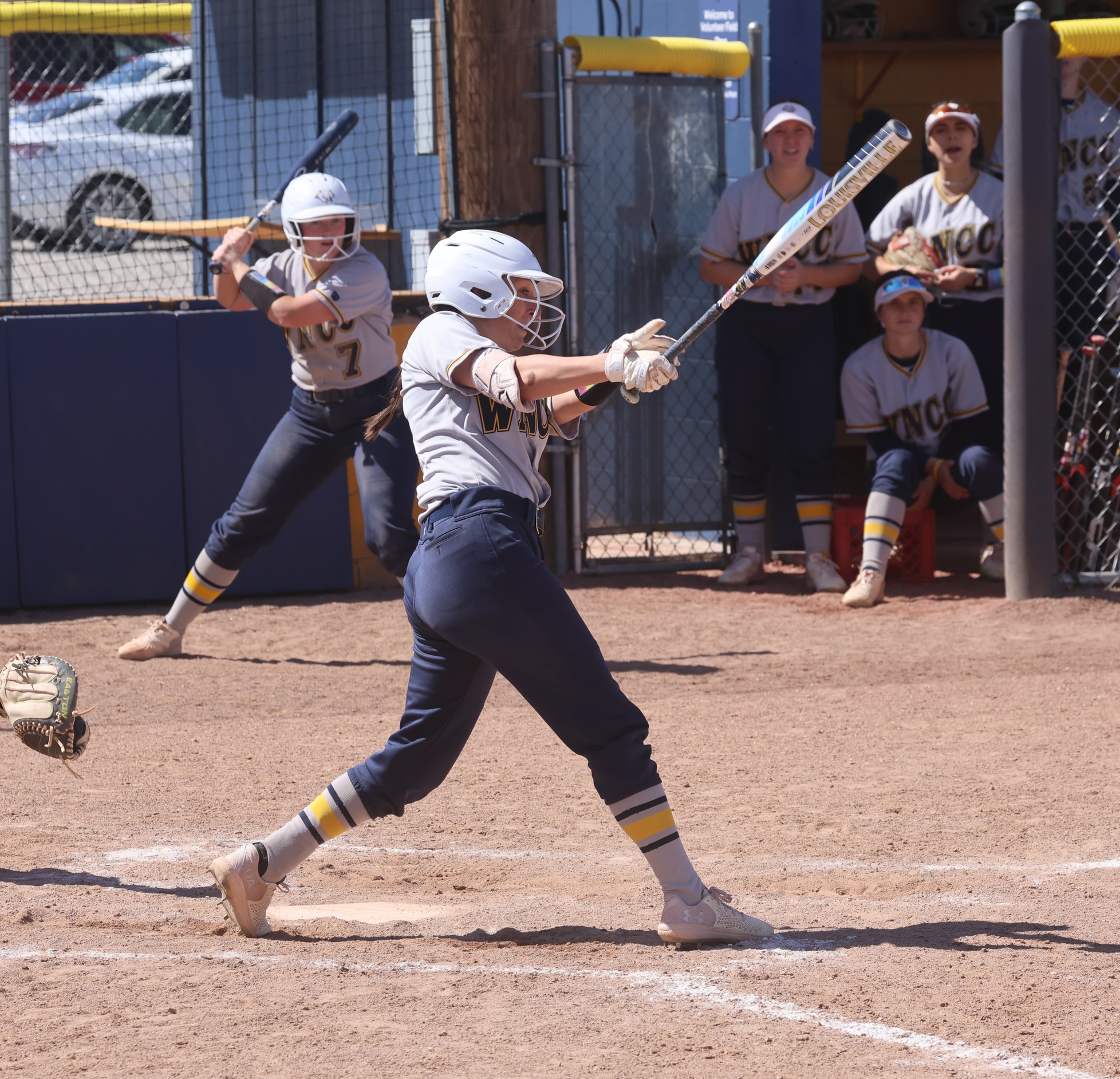 Mykah Klumpp watches her first-inning home run clear the fence.