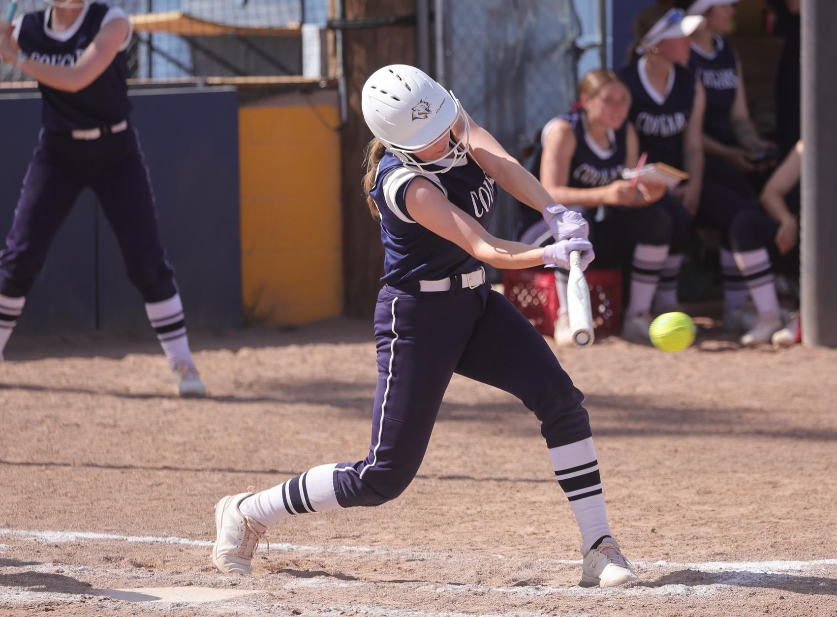 Hayley Blumenshein gets a single in the second game to score some runs as the Cougars took the doubleheader from Miles on Saturday.