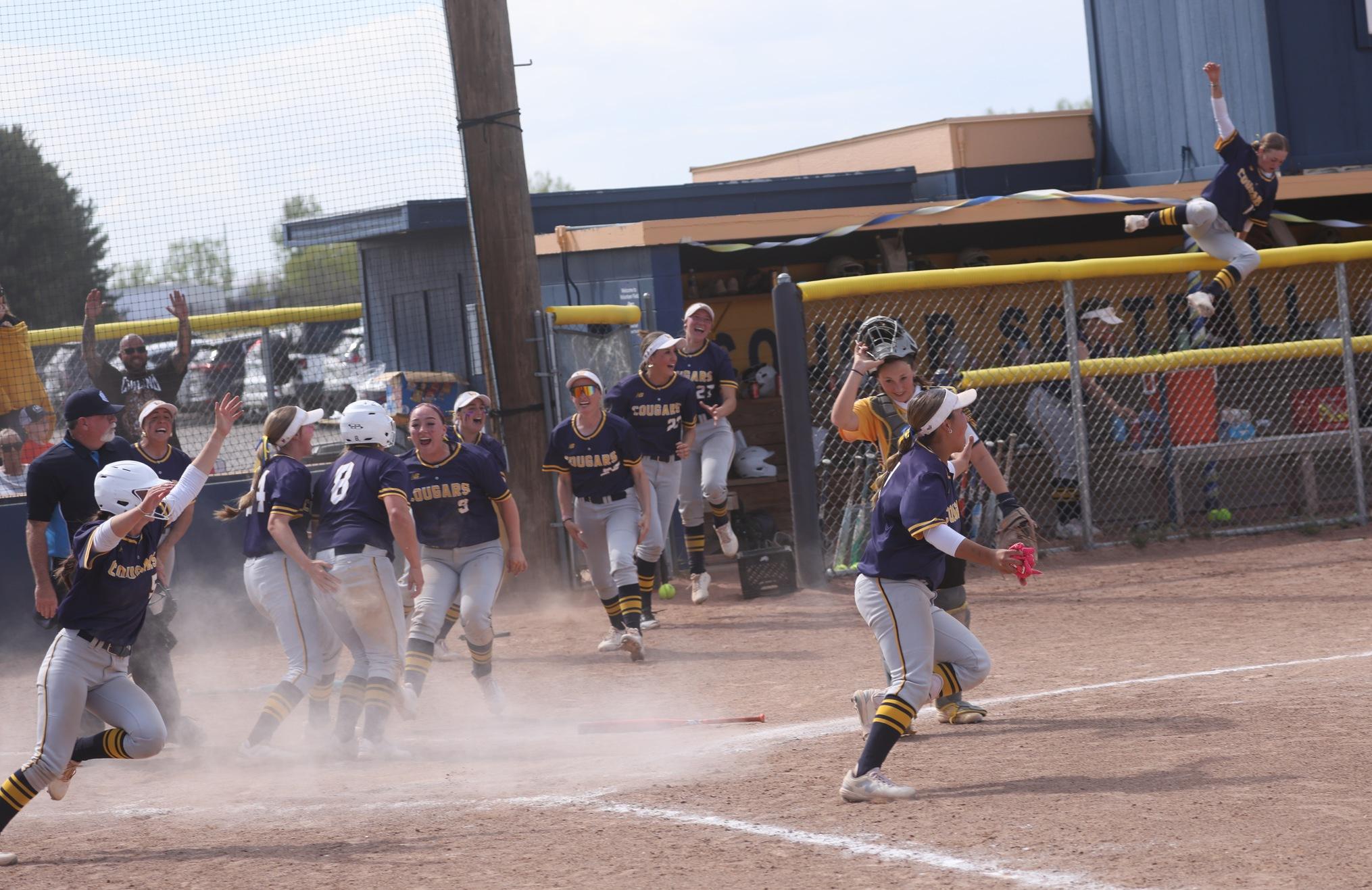 WNCC players go crazy as they celebrate Adi Duke scoring the game-winning run in the seventh of game two with North Platte on Sunday.