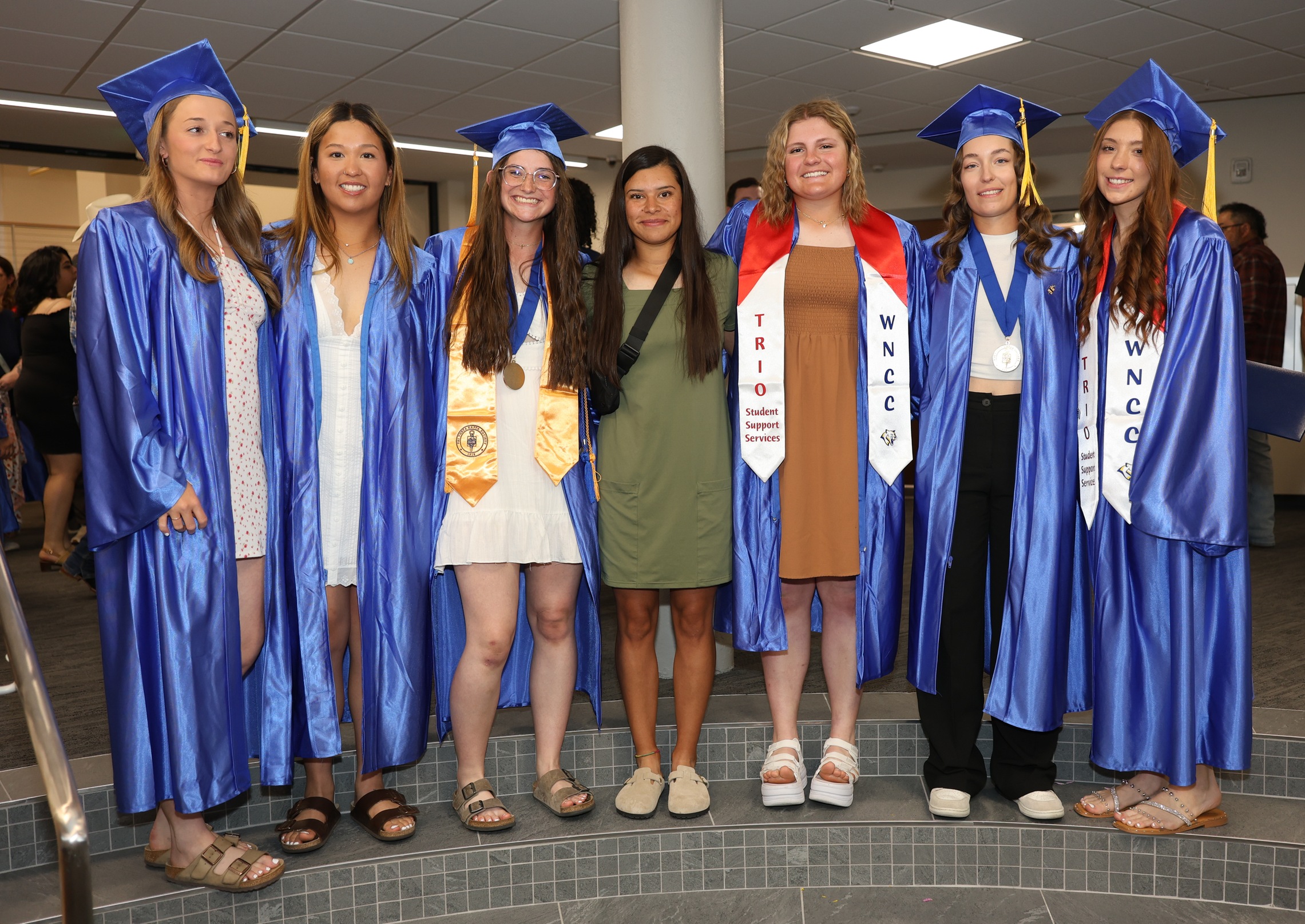 Nayeli Diaz with the six graduating sophomores after the graduation ceremonies in May.