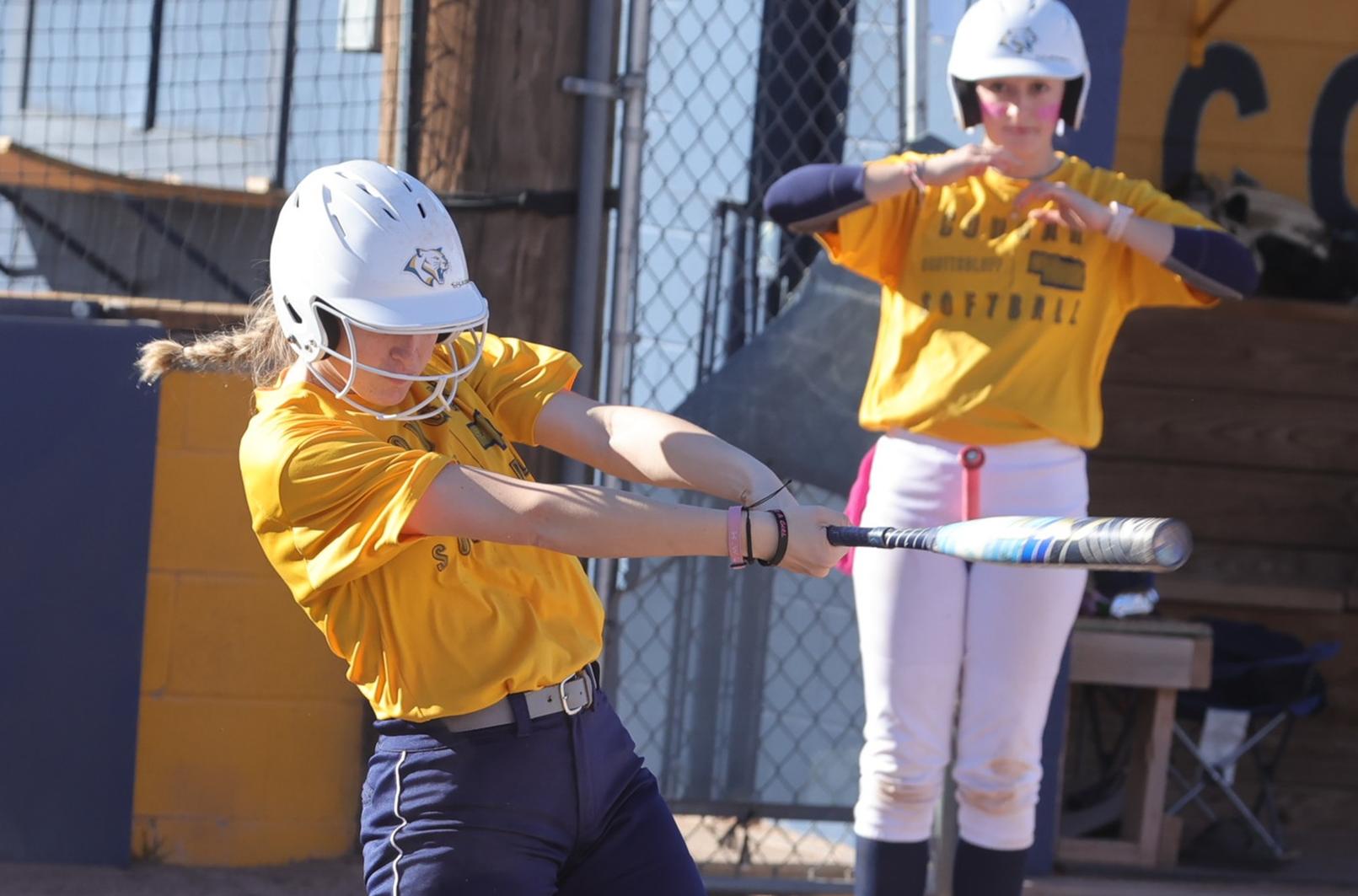 Dannaca Moss, of West Jordan, Utah, makes solid contact with a pitch in Saturday's scrimmage.