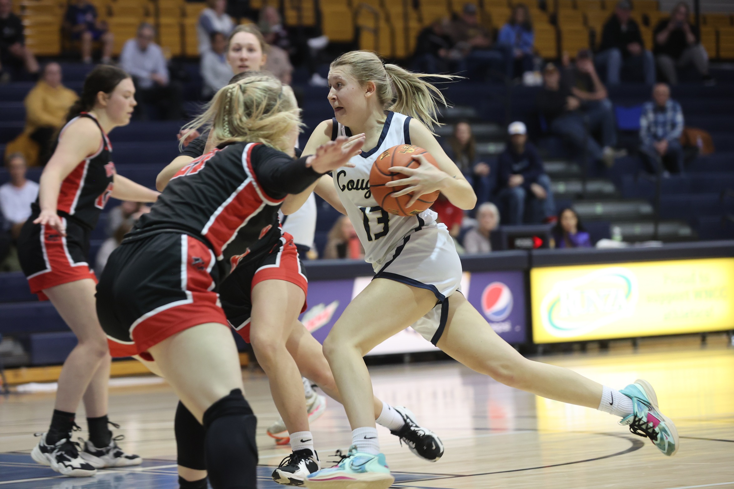 Bre Fowler driving to the basket against Western Wyoming.