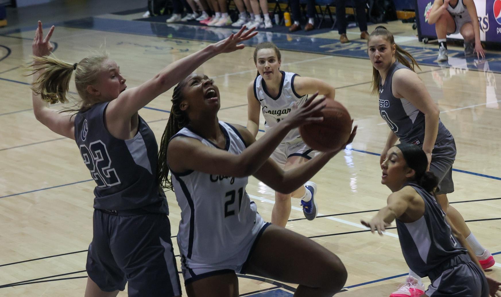 Faith Walker goes in for two points.