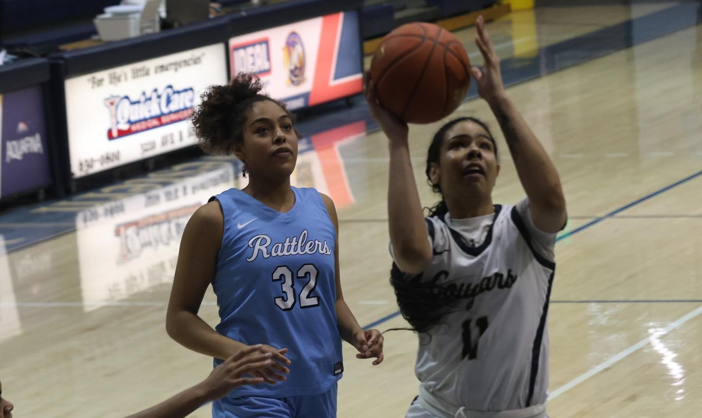 Asia Mitchell goes up for two points against Otero.
