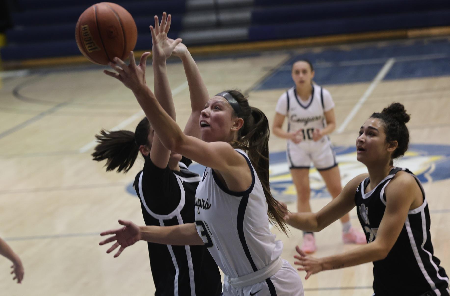 Nataly Dunka goes up for two points in their game Monday with NJC.