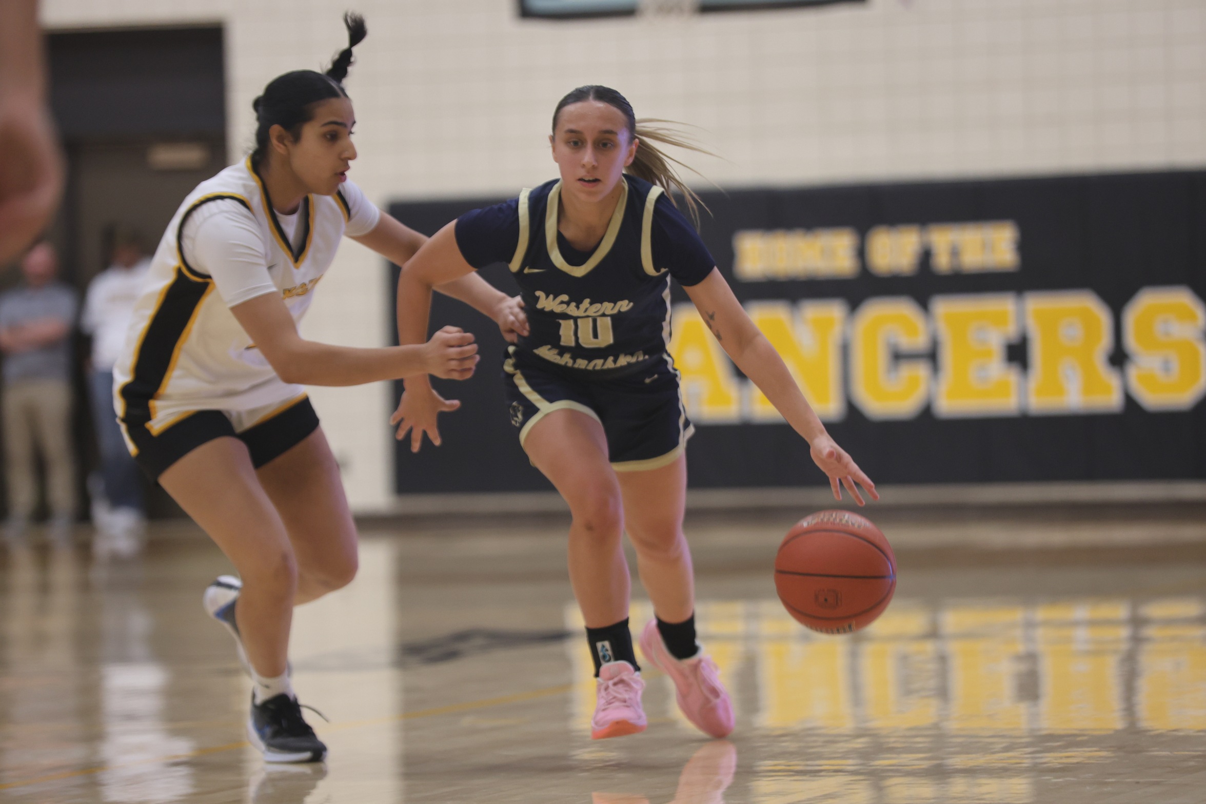 WNCC's Helena Kuck brings the ball up the court in the first half against ewC in Torrington, Wyoming.