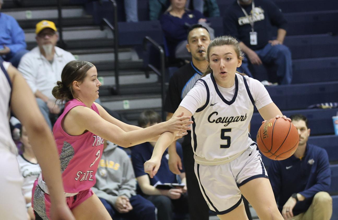 Arianna Myers dribbles to the paint in their game Saturday against Trinidad.