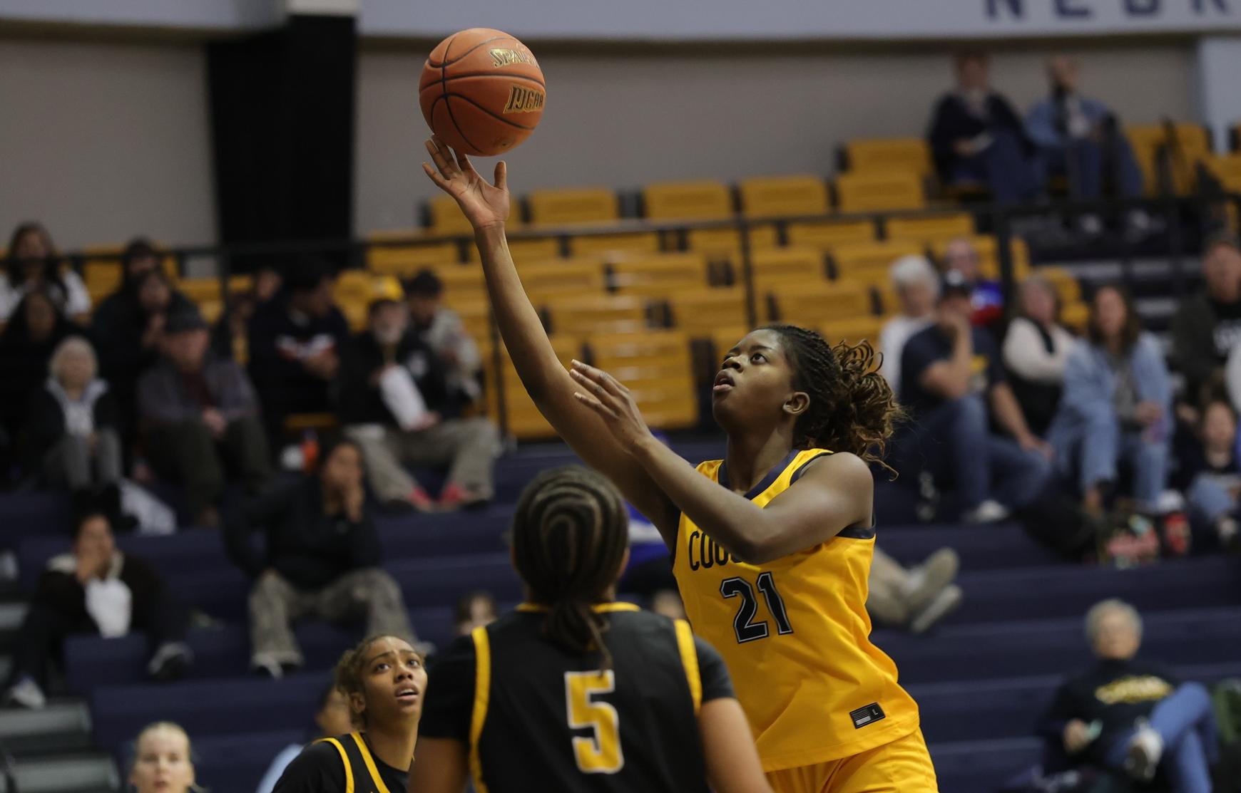 Celena Donyo goes up for two points against EWC on Tuesday.