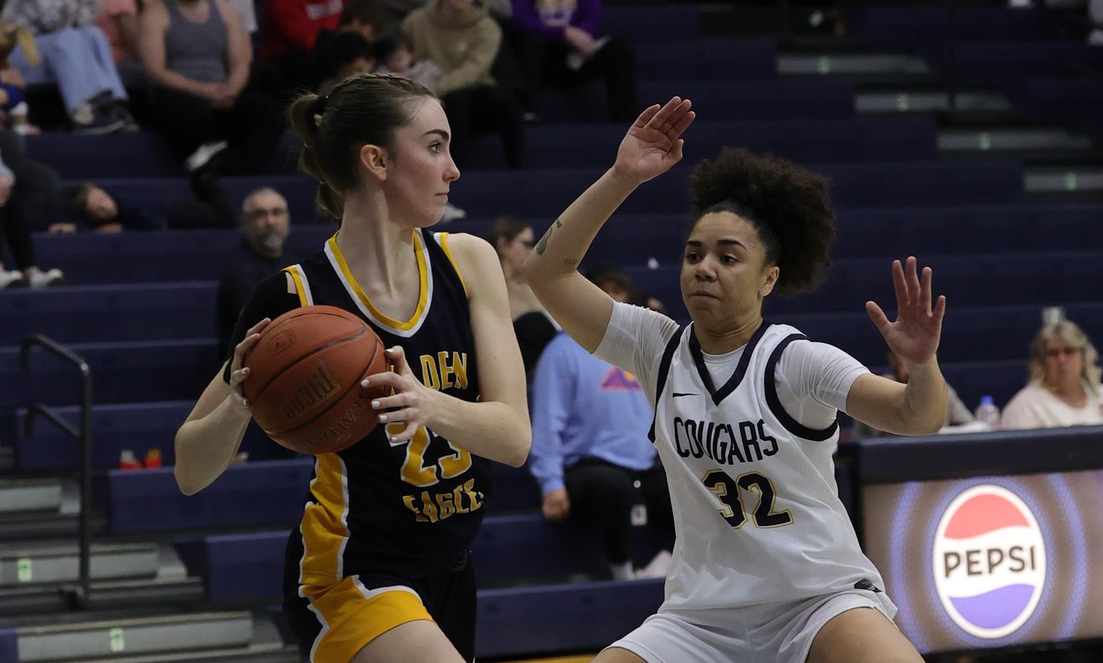 WNCC's Ella Chesta-Carty plays defense on a LCCC player. The Cougars fell to the Golden Eagles on Saturday to end their season. (photo courtesy of Nicole Messman)