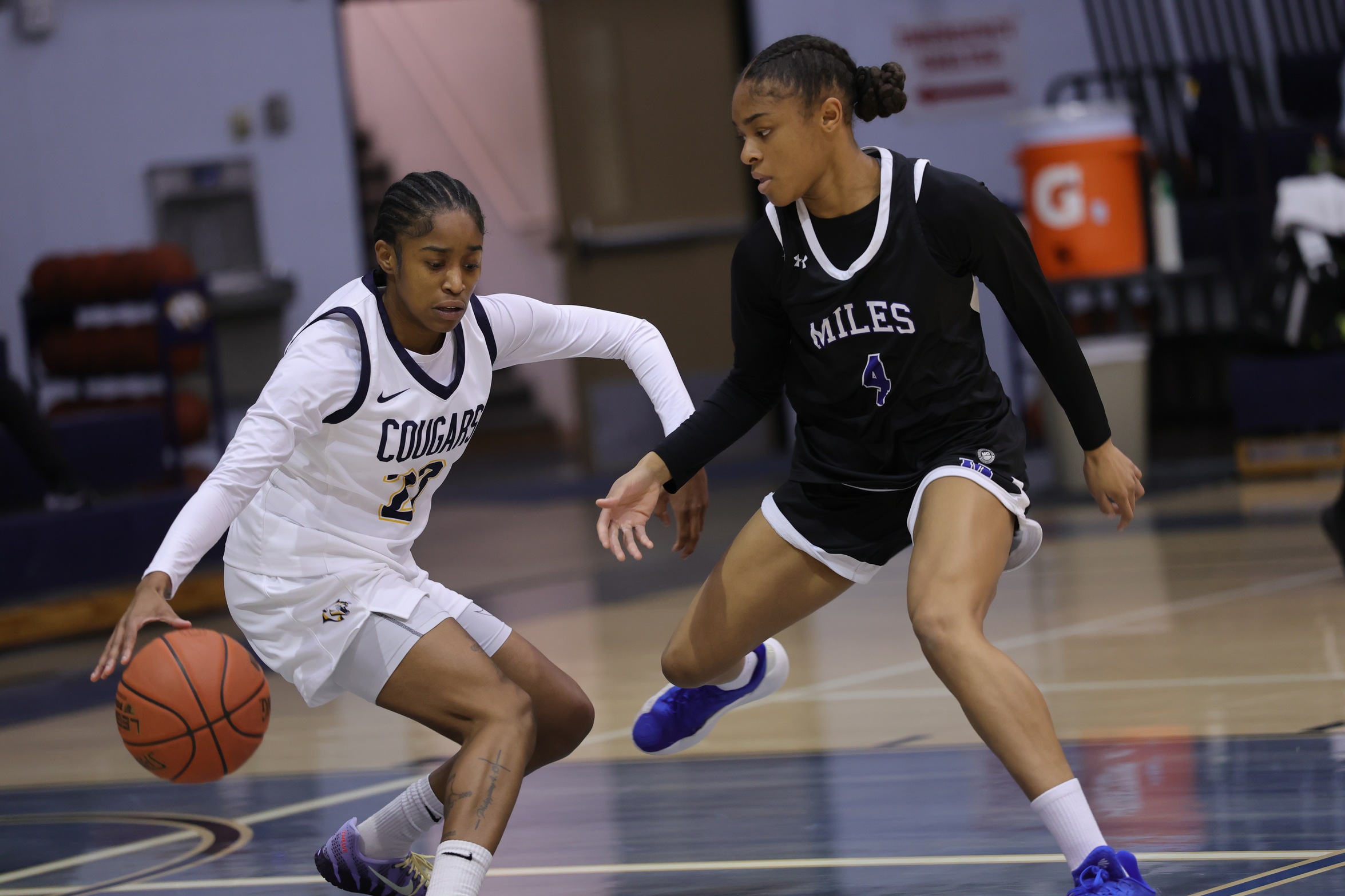 Charisma Johnson drives up the court against Miles in November.