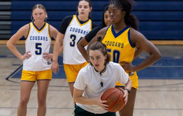 Shayane Poirot shows players last year how to run a drill.