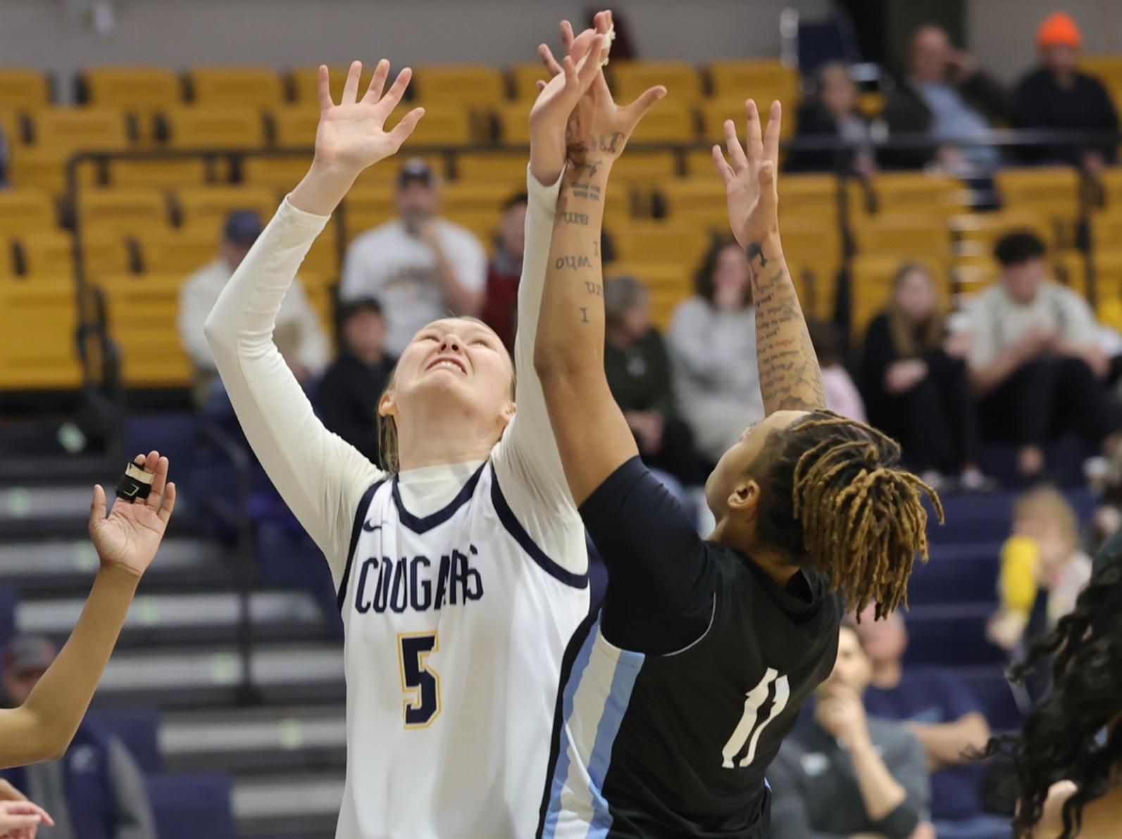 Ruth Lively goes up for a rebound in the game with Southeast.