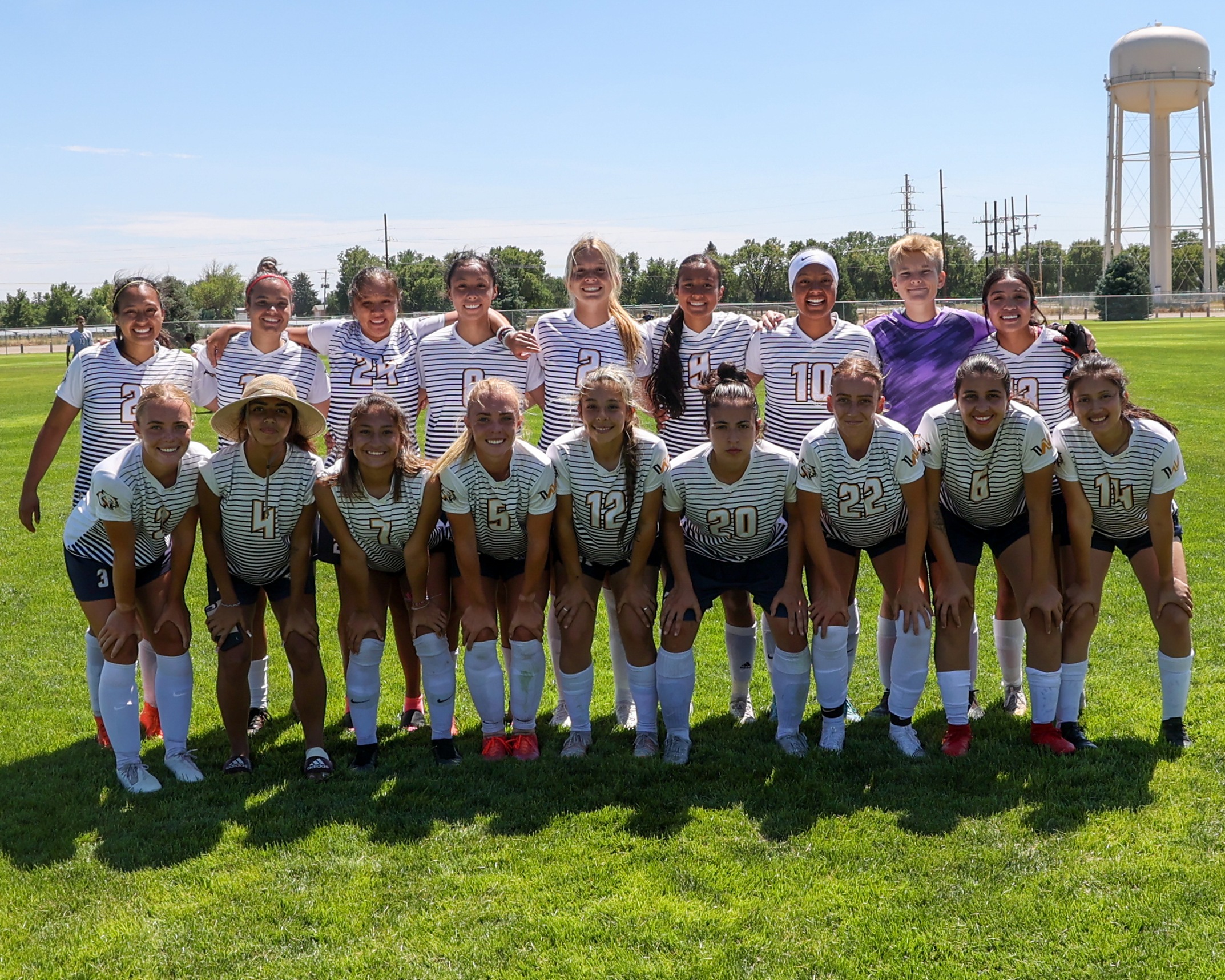 Women's soccer team photo at alumni game.
