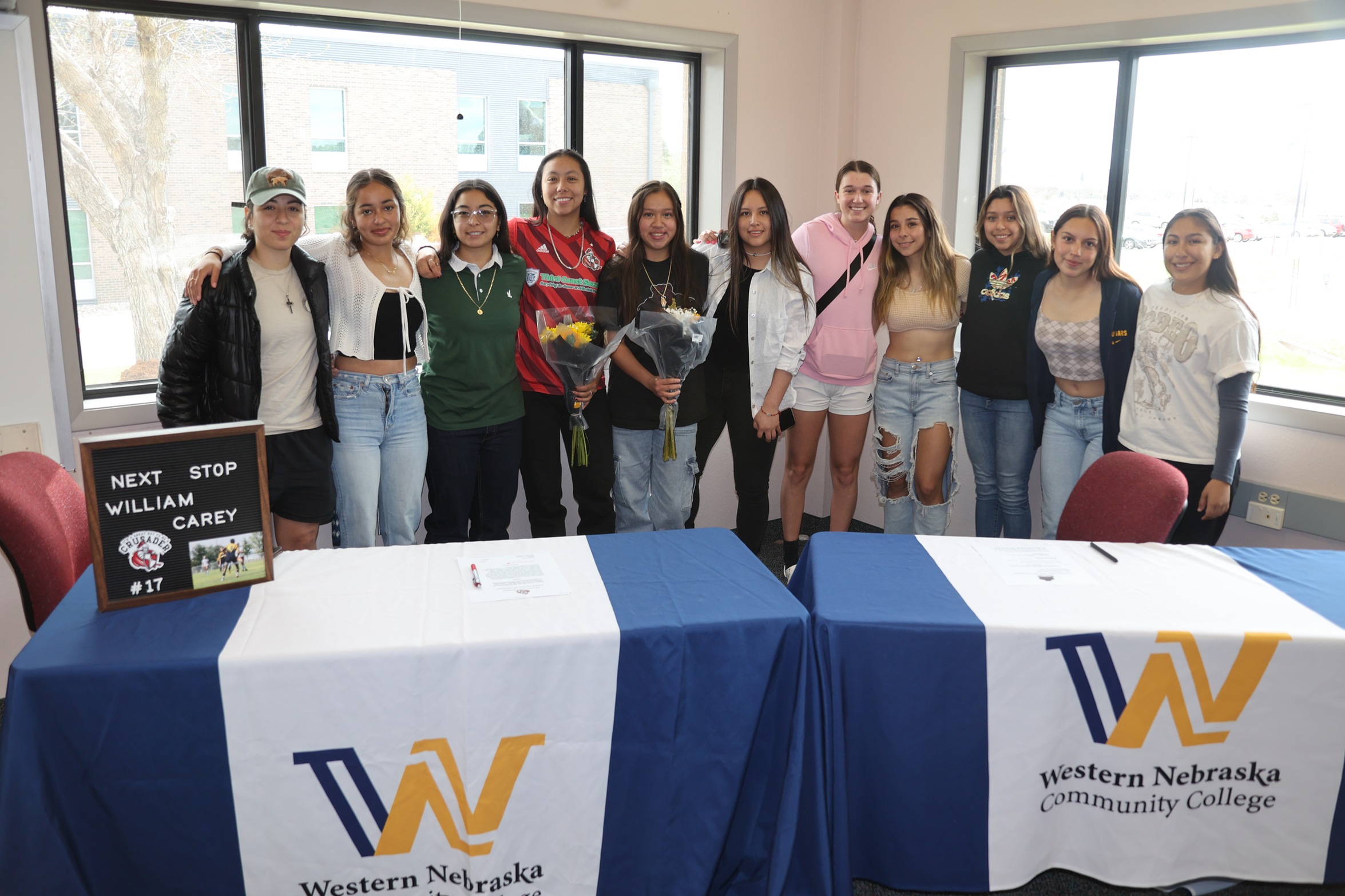 Lesley and Tania with the team after signing last week.