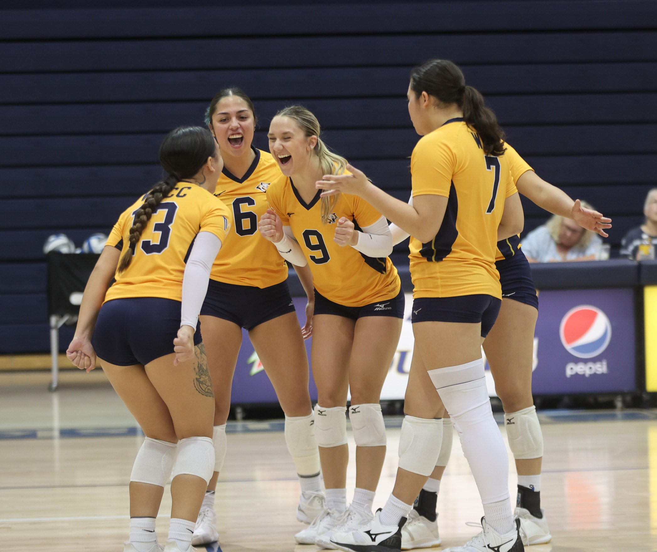 Cougars celebrating a point.