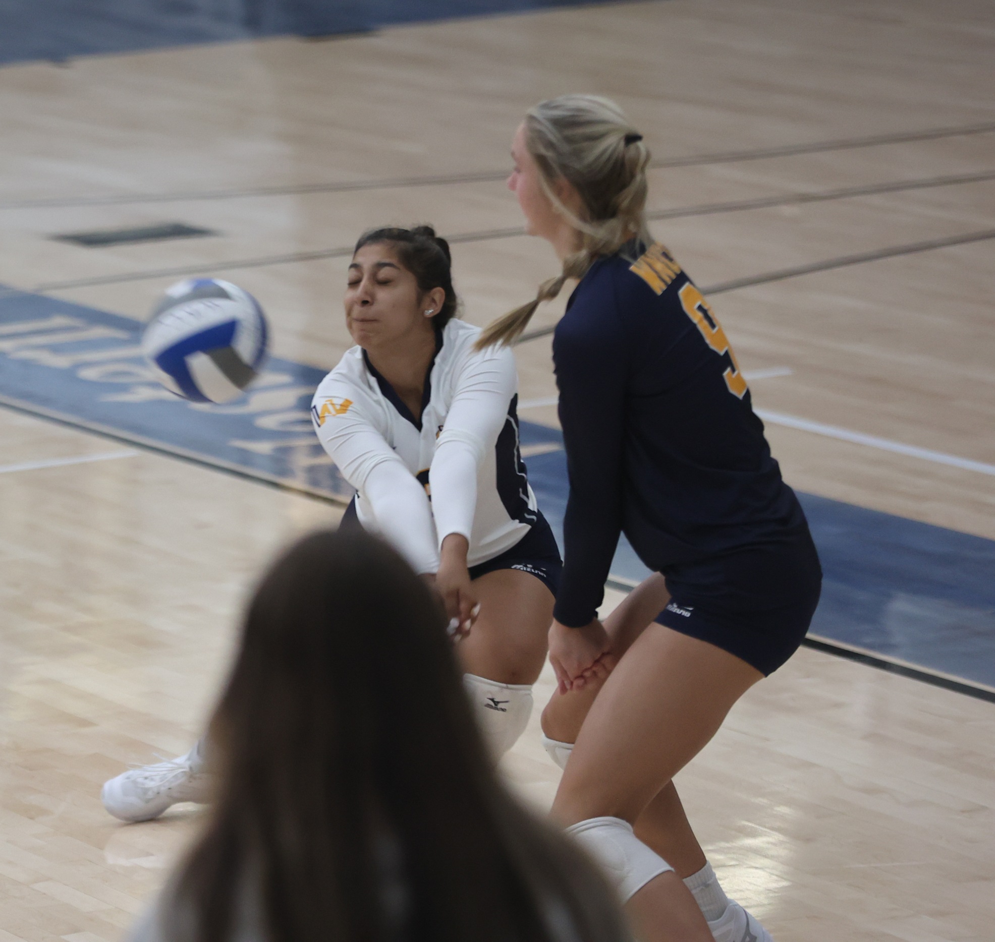 AK Chavez digs up a ball during a scrimmage game.