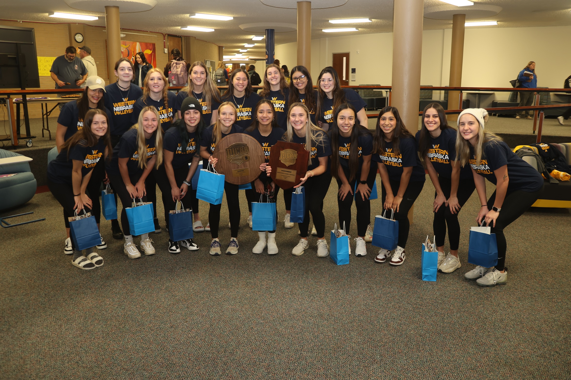 The Volleyball team with the trophies at the send-off to nationals on Monday.