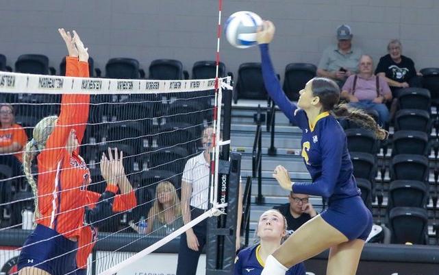 WNCC's Chloe Grady goes high to hit a kill against Snow College (photo courtesy of WNCC President Greg Dart).