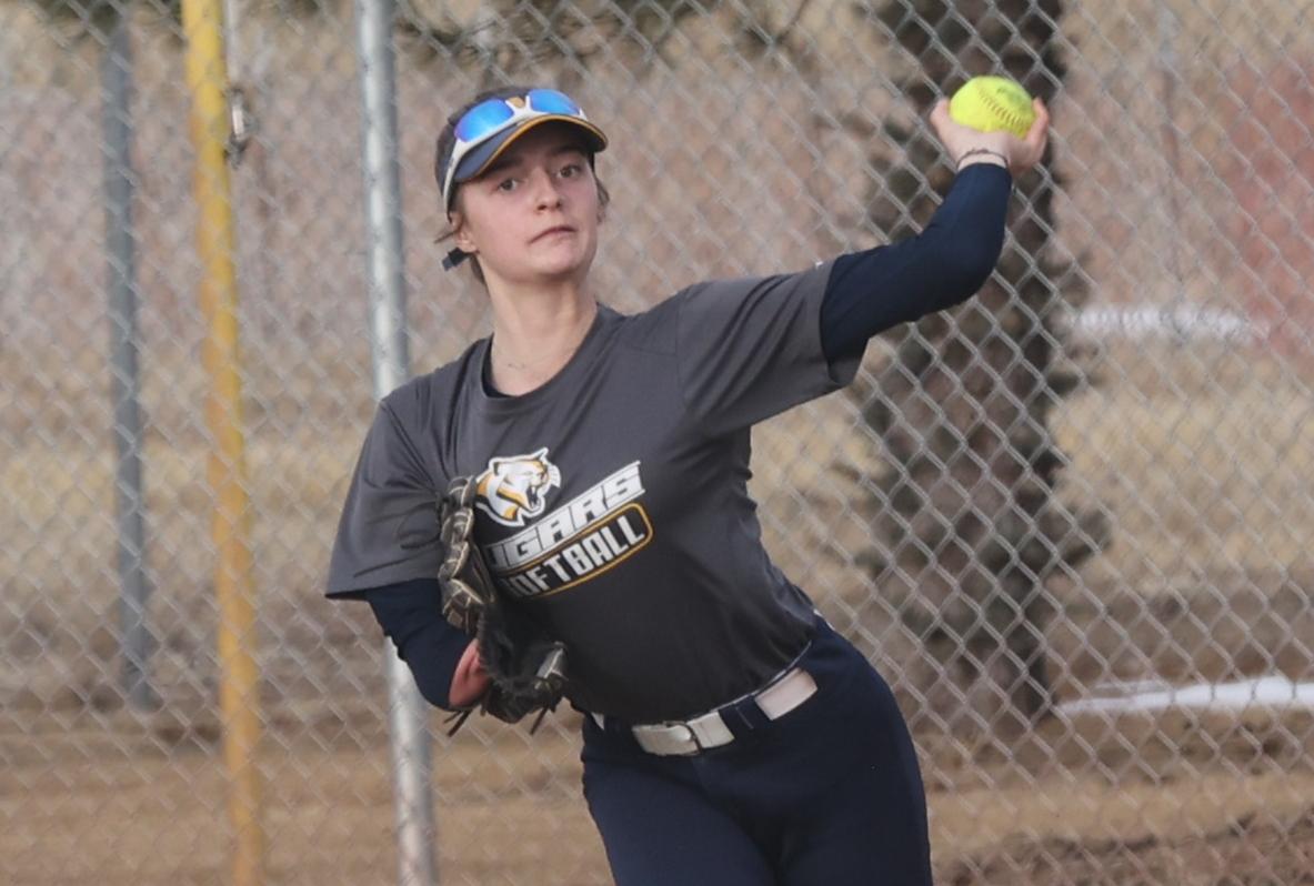 Devynn Priselac throws the ball in after making a catch in the outfield in practice February 1.