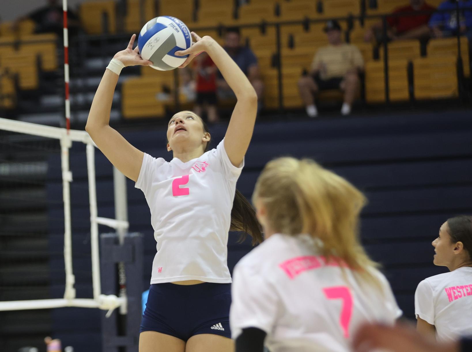 Nora Marginean sets the ball to Tamika Eastman in the second set.