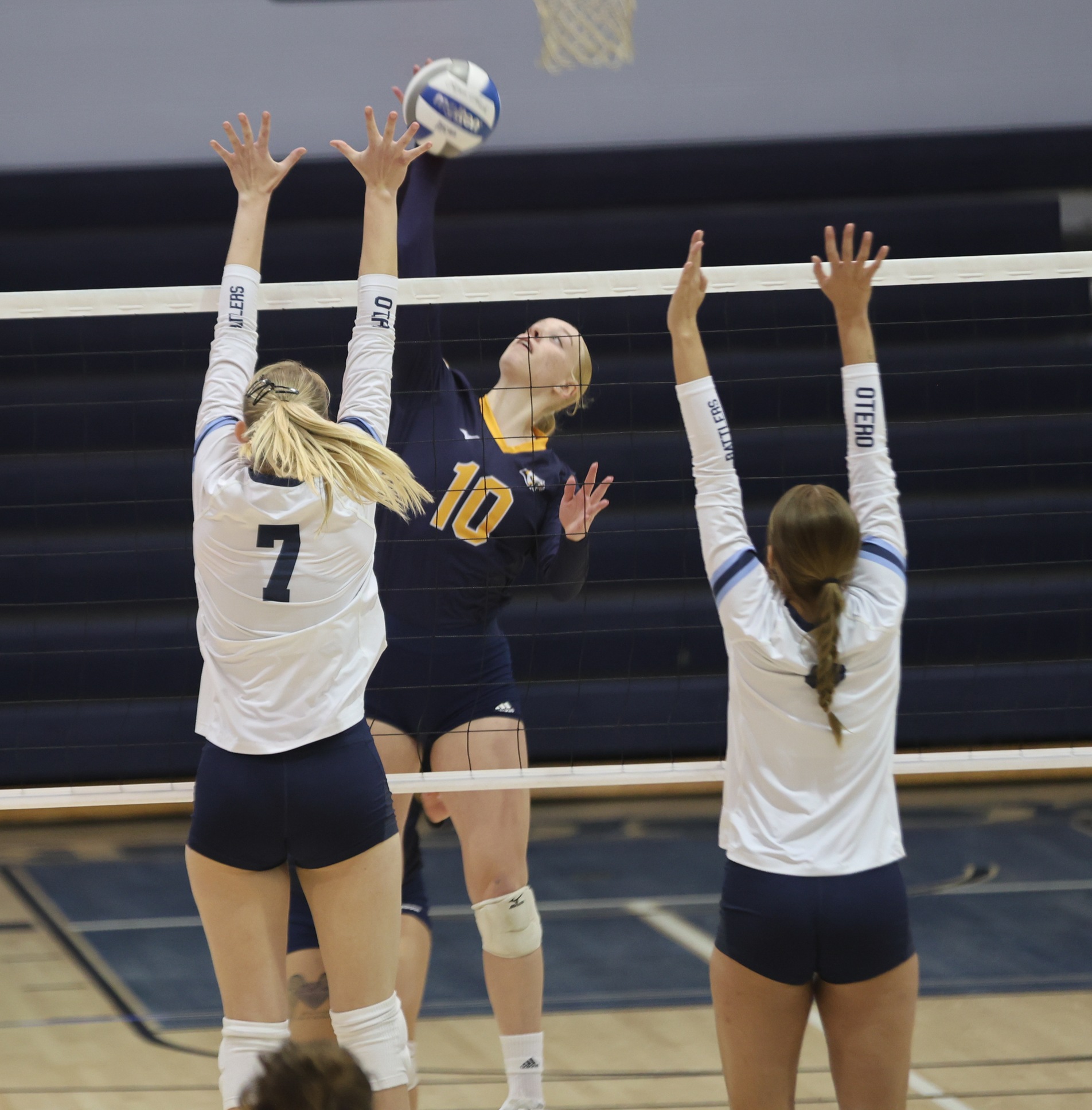Finja Schul hits over the block of two Otero players on Saturday.