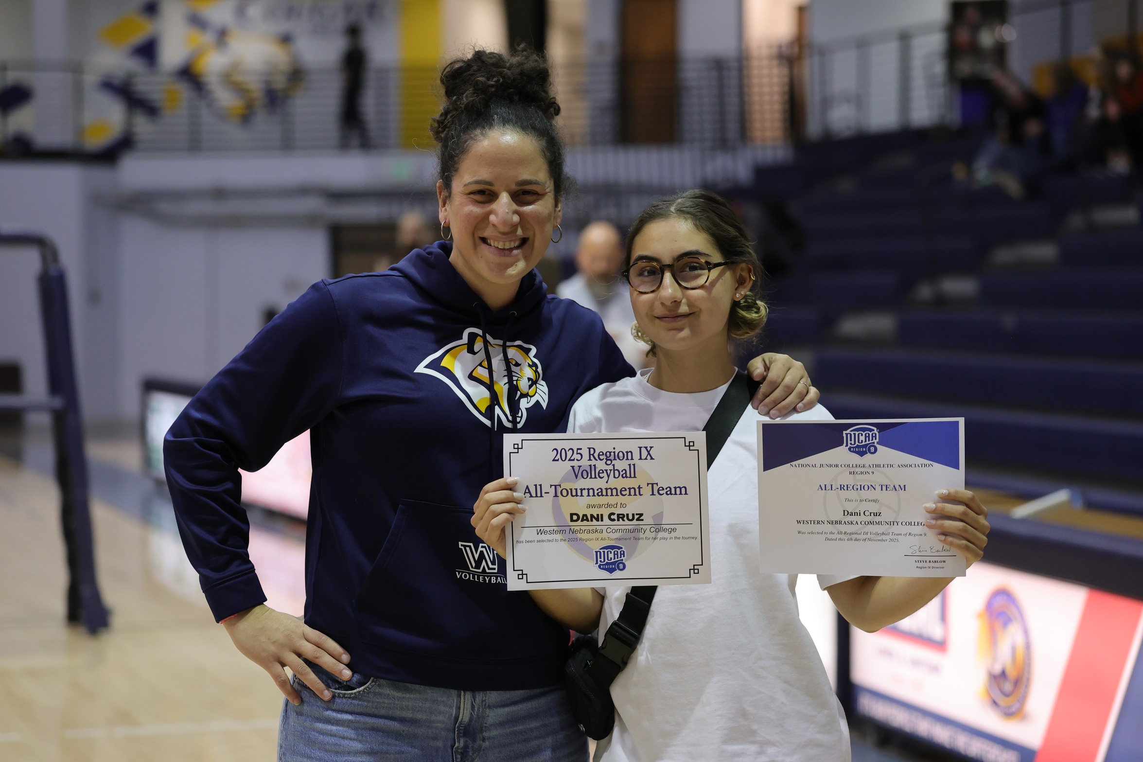WNCC head coach Fatima Balza with Cougar sophomore Dani Cruz as she shows her All-region and All-tournament certificates after the championship game on Saturday.