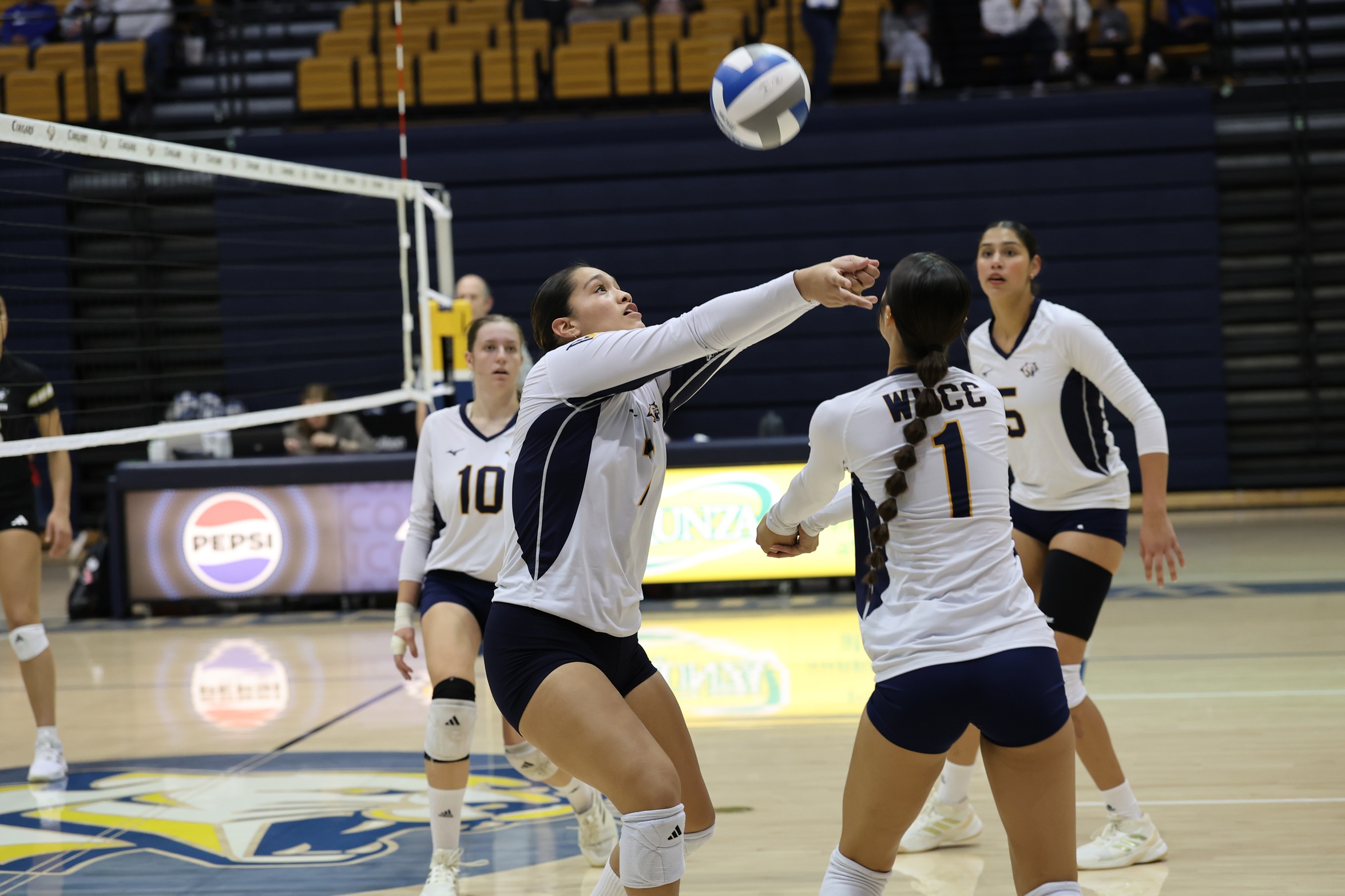 Keira Zelada passes the ball while Anika Davison backs her up in their match on Tuesday with NJC.